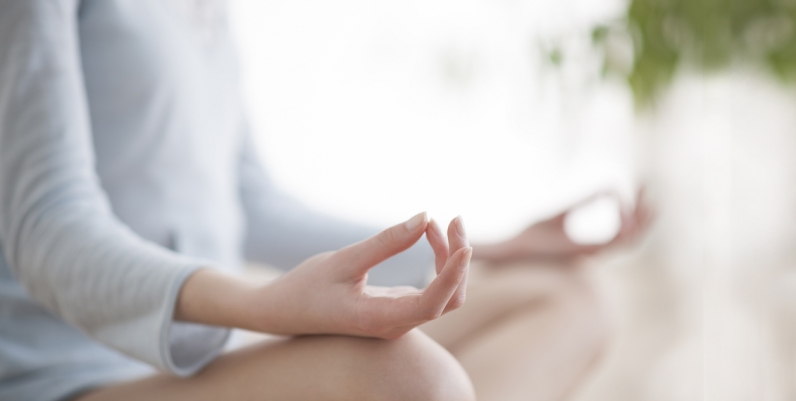 Health and Wellness Programs Closeup of a woman practicing yoga