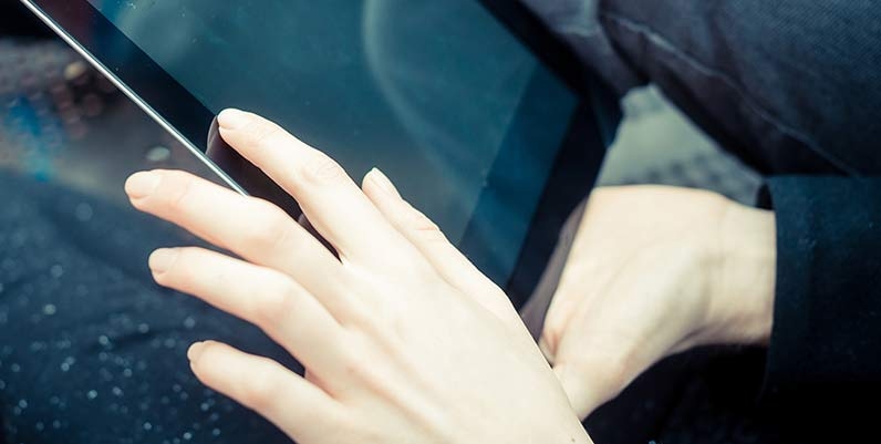 Hoopla Closeup of hands holding a tablet