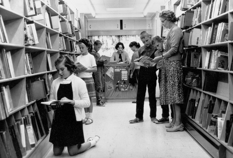 History of the Bookmobile Archival photo of children inside the Bookmobile circa 1950s