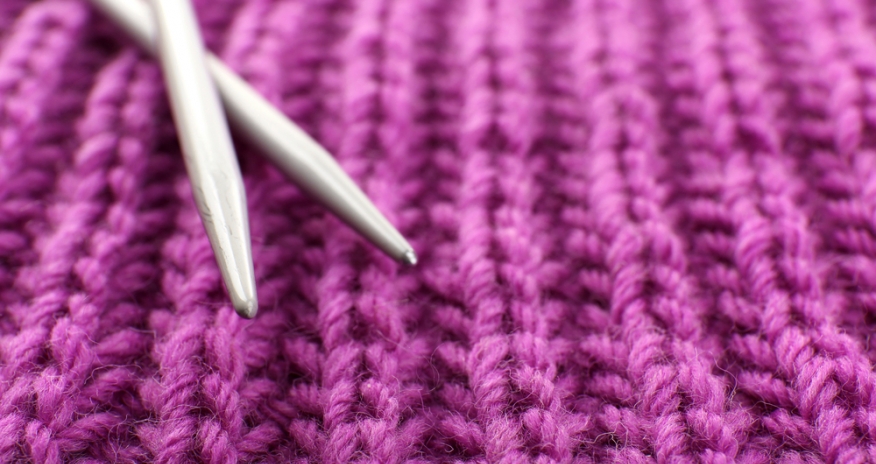 Knitting and Crochet Closeup of knitting needles on wool