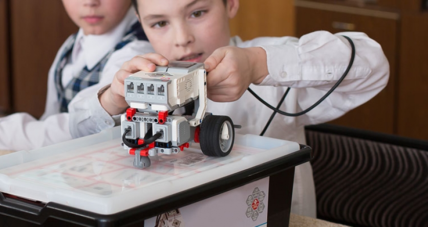 The Incredible Machine: LEGO Mindstorms boy playing with LEGO Mindstorms