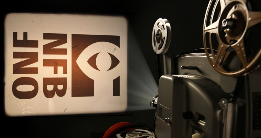 National Film Board Photo of a film projector projecting the National Film Board logo onto a wall