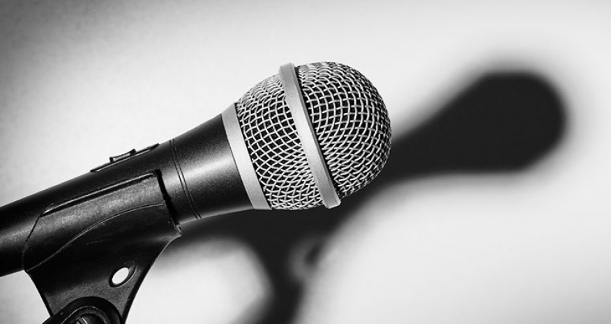 Author Event black and white photo of a microphone