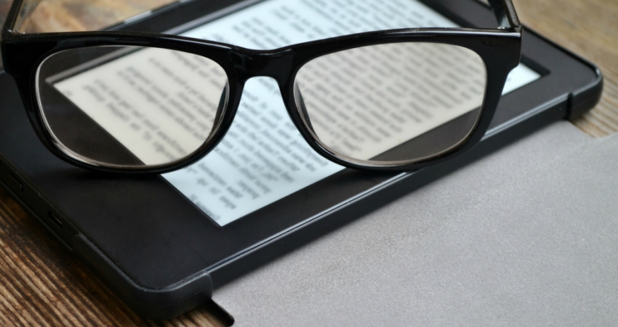 eReaders Reading glasses resting on an eReader