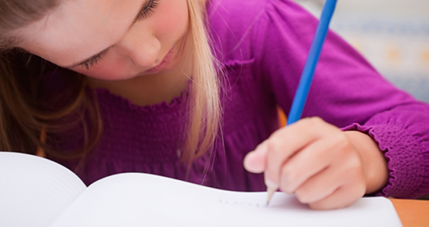 Tween Writing Contest a photo of a girl writing on a notebook