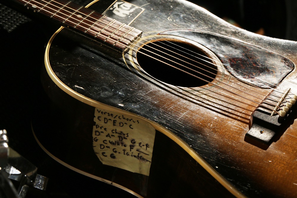 Closeup of Tom Wilson's guitar at the Blackie and the Rodeo Kings concert