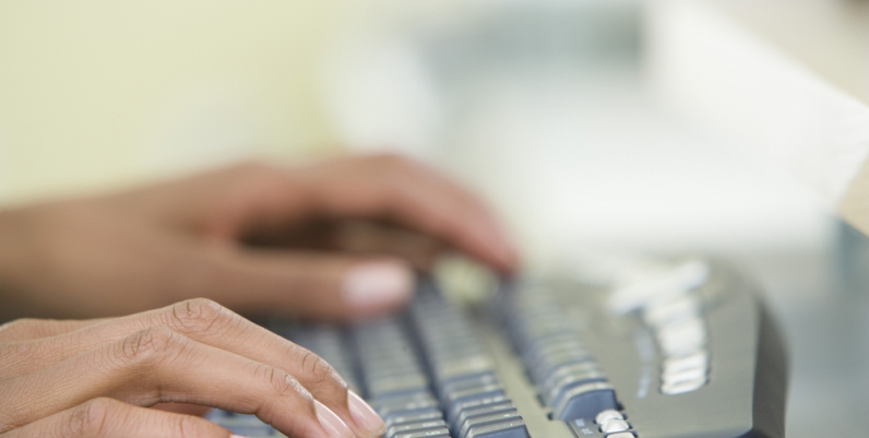 Computer Classes Closeup of hands on a keyboard