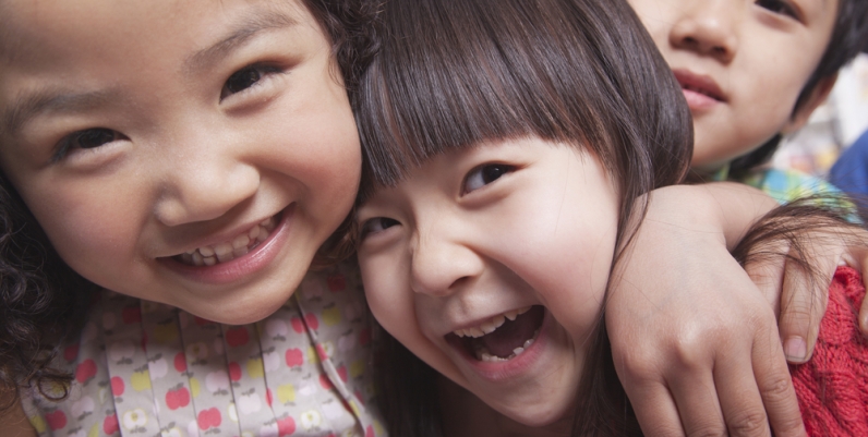 Closeup of young children laughing