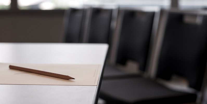 Closeup of chairs around a meeting room table