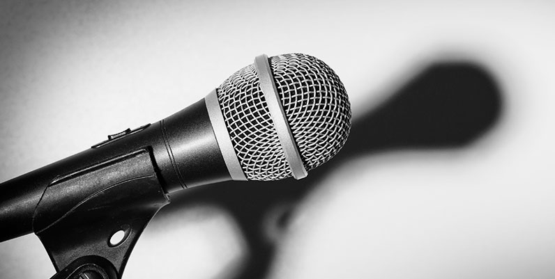 Author Event black and white photo of a microphone