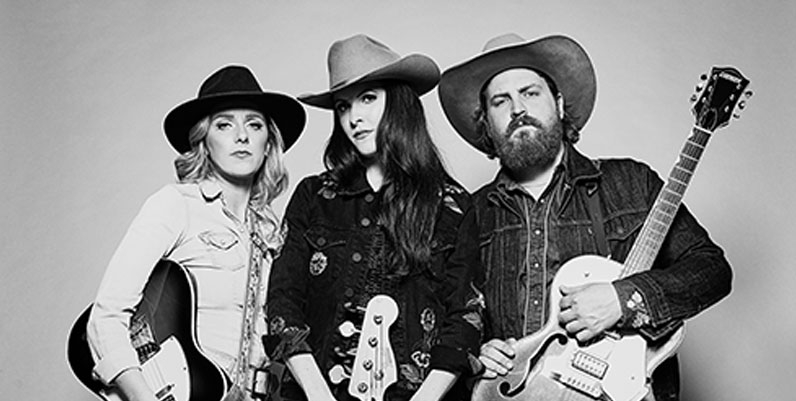 RedHillValleys photo of two females and a male holding guitars