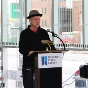 a man speaking behind a podium