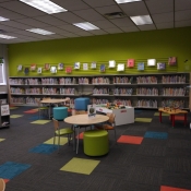 The children's area with colourful carpet and games for the children.