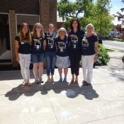 Ancaster staff members standing outside near all the sidwalk chalk drawings