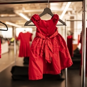 Small red dress hanging. 