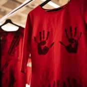 Red dresses stained with tire mark and hand print. 