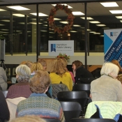 a photo of a group of people sitting and waiting for a program to start