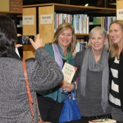 a photo of a group of females having their photo taken 