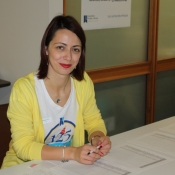 a photo of a female at a registration desk 