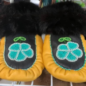 Fur lined black and yellow moccasins with flower design