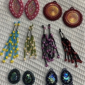 Various Native beadwork earrings and broaches