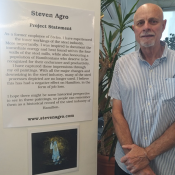 Steve with his art displayed on the 4th floor of Central Library