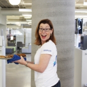 female handing out cookies