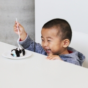 boy enjoying his cake