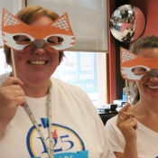 two females wearing a fox mask