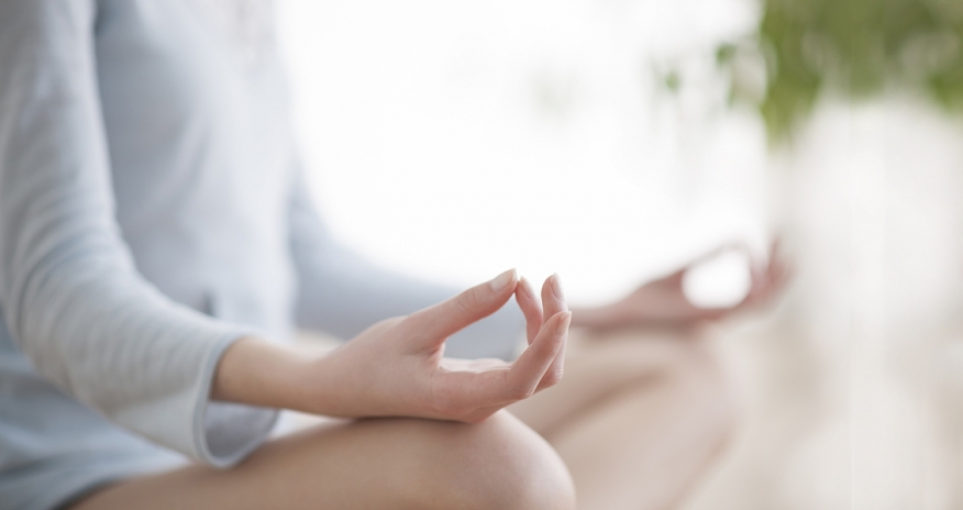 Health and Wellness Programs Closeup of a woman practicing yoga